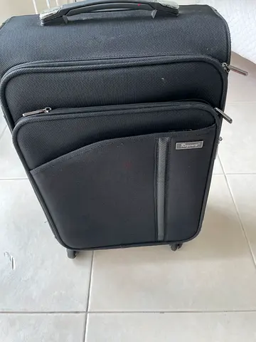Black Regency soft-shell carry-on suitcase with front pocket