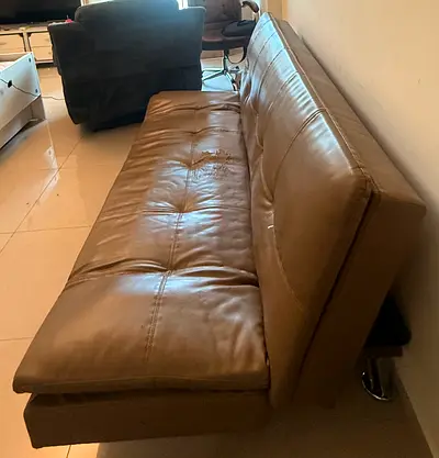 Brown faux leather sofa bed — used, needs minor repair