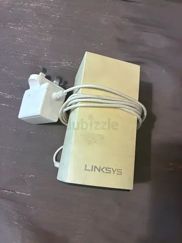 Linksys small router/power adapter - used