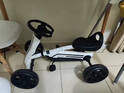 lightweight and battery-free pedal ride-on toy designed for young riders.