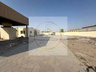 Industrial Yard for Rent in Al Sajaa, Sharjah, 20,000 Sq Ft with Interlock Flooring, Covered Shed, 32 KW Electricity and Office