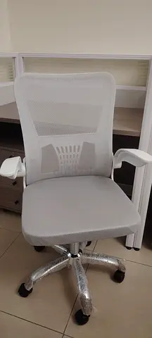 White ergonomic mesh office chair with lumbar support