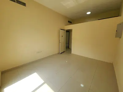 Two master bedrooms and a separate living room, located opposite the Al Nuaimiya Towers; utilities included.
