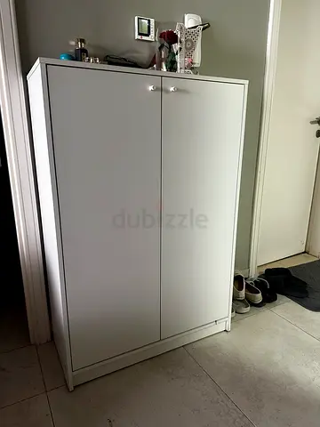 Simple white two-door shoe/storage cabinet - good condition