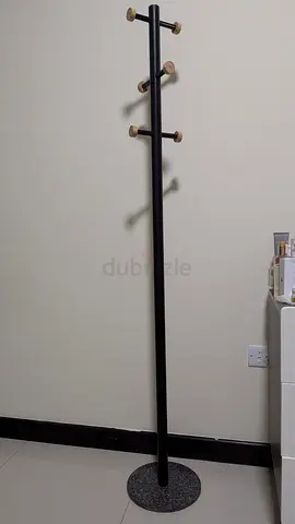 Slim black stone coat rack with wooden pegs - freestanding