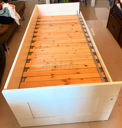 IKEA Single wooden slatted bed frame with storage-friendly design