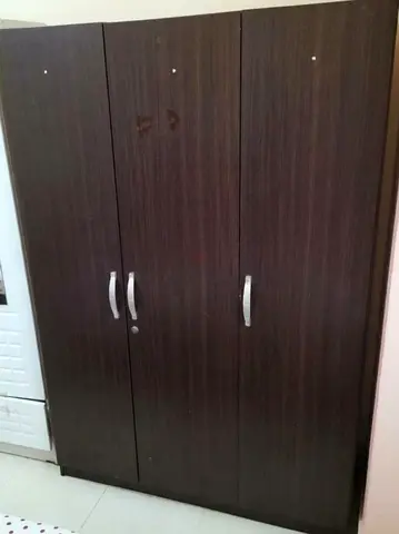 Dark wood 3-door wardrobe / armoire in good condition