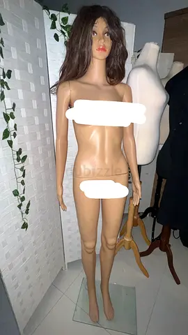 Full-size female display mannequin with wig and glass base