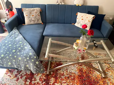 Blue L-shaped convertible Sofa with Glass Coffee Table - Good Condition