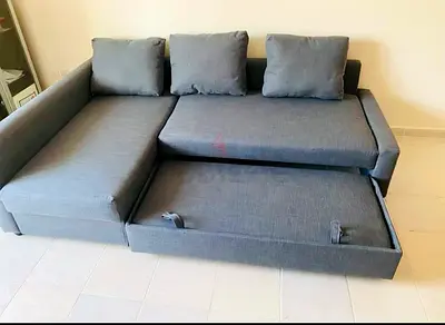 IKEA L-shaped sofa with pull-out bed for sale