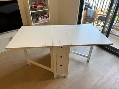 White extendable dining table with built-in drawers - Very Lightly Used and in Excellent Condition