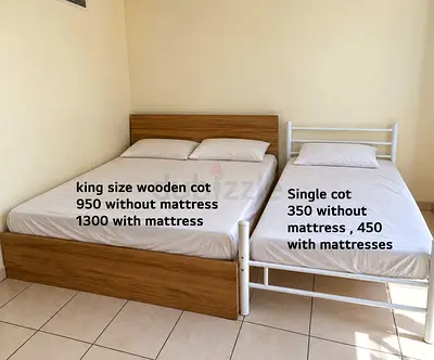King size wooden bed frame + single metal bed frame (available separately)
