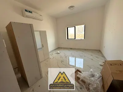 A studio available for annual rent in Al Alia, Ajman, featuring a semi-separate kitchen and split air conditioning. The property is conveniently locat