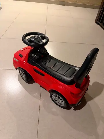 Red ride-on push car for toddlers - good condition