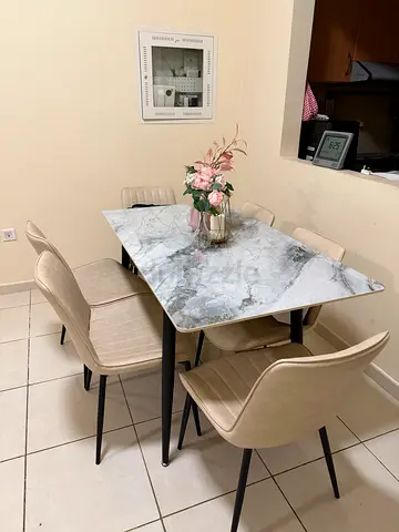 Dining table set with marble-look top and 6 beige chairs