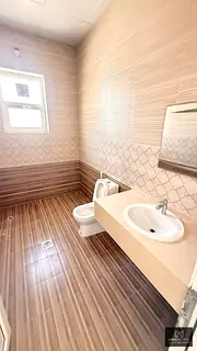 For rent in ALshamkhah: a villa in a prime location close to all services, with super deluxe finishe