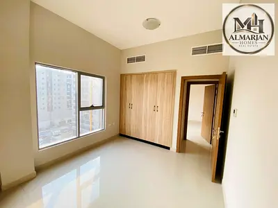 Two-bedroom apartment with a living room, second-occupancy, featuring built-in wall closets; locate