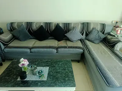 Gray fabric L-shaped sofa set with matching armchair and coffee table set