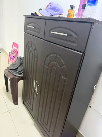 Dark brown wooden cabinet with two drawers and double doors - good condition