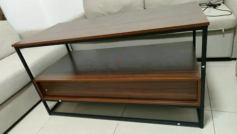 Wooden coffee table with lower drawer and metal frame