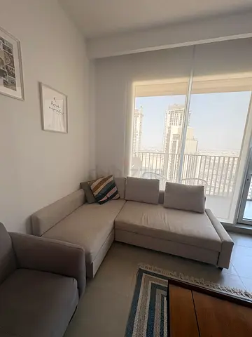 Light grey L-shaped Ikea fabric sofa bed (3-seater) in good condition