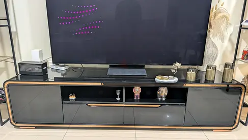 Modern glossy TV unit / entertainment center - black with golden trim