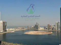 2-bedroom apartment in Al Taawun, Sharjah, featuring a living room, balcony, and 2 bathrooms. Contac
