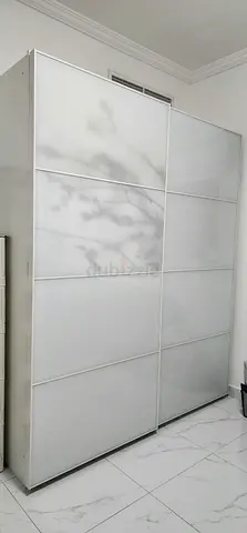 Full height, white color, sliding type wardrobe