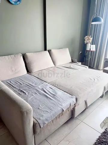 Light beige L-shaped sofa bed