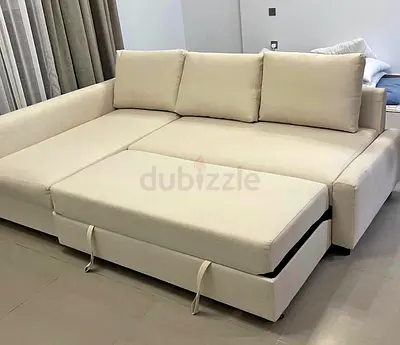 Beige L-shaped Sofa Bed with Pull-out Ottoman - Good Condition