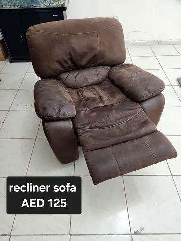 Brown leather recliner armchair - used, comfortable, AED 80