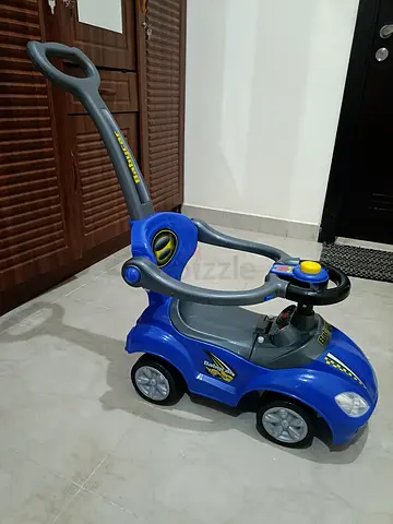 Blue push ride-on car with parent handle - good condition