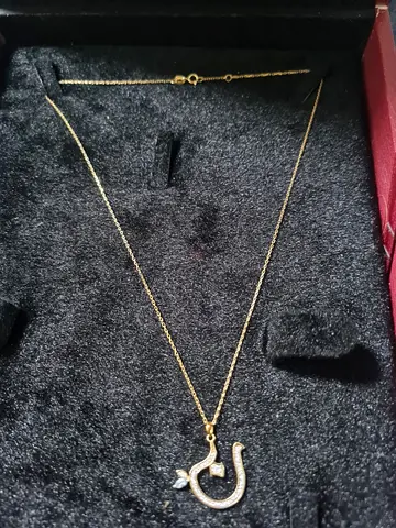 18k gold and diamond Noon alphabet weight 2.74 grams No invoice Final price is 1200