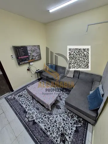 ** Couch Cozy Family 1-Bedroom Apartment for Monthly Rent in Al Rawda 3, Ajman | All-Inclusive Rate