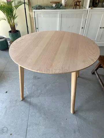 Light wood round table 105 cm X 74,5high