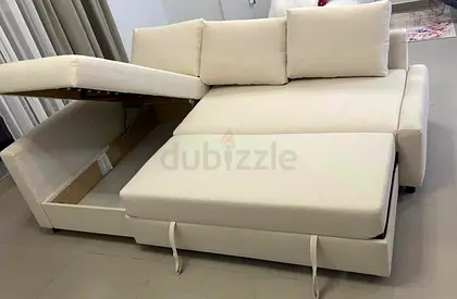 Beige L-shaped Sofa Bed with Storage - Good Condition