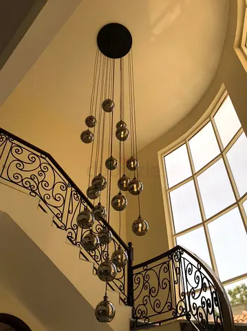 Modern multi-pendant chrome bubble chandelier - statement stairwell light