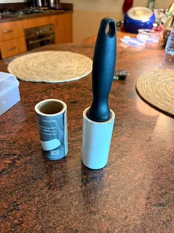 Reusable lint roller with 1 spare refill