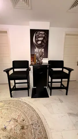 Pair of black high bar director chairs with small stand . Billiard stock holder