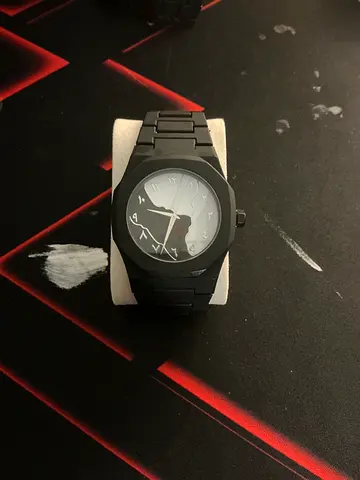 Black men's wristwatch with Arabic numerals, metal bracelet