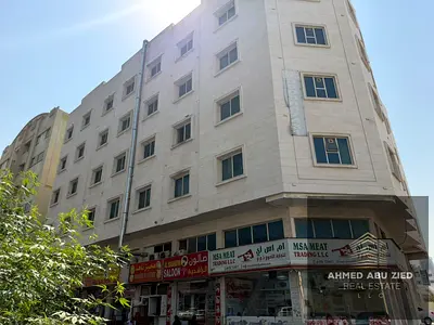Residential-commercial corner building for sale in Al Rashidiya. Prime location, with a 7% annual yield that has the potential to increase.