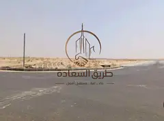 # Prime land in Al-Ruwaidhat | Second block from the main road | 18-meter street | Freehold ownershi