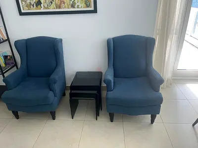 Crate and Barrel  blue wingback armchairs with glass nesting side tables - good condition