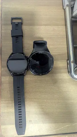 Two used smartwatches - black round touchscreen models. Huawei GT2 and GT3