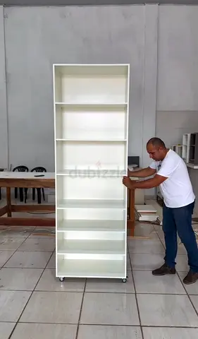 Tall white wooden bookshelf on wheels - 8 shelves, new
