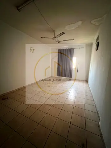One bedroom and living room in Al Qasimia with a hallway and balcony prime location next to services and full maintenance is the responsibility of
