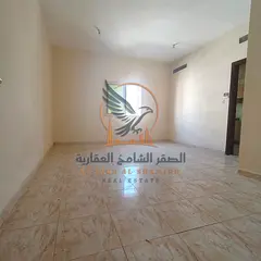 For annual rent in Ajman a spacious studio apartment in Al Rashidiya 3 featuring a semi-separate kit