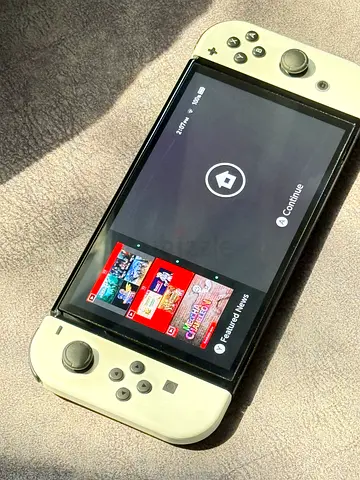 Nintendo Switch OLED with official white dock — good condition