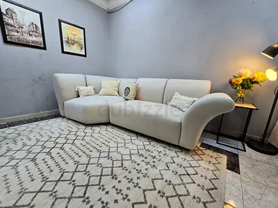 Light beige modern L-shaped 3-seater sofa with chaise - good condition