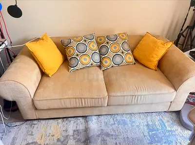 Beige 3-seater fabric sofa with cushions